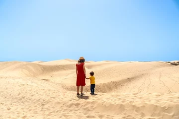 Papier Peint photo autocollant les îles Canaries Mother and son on vacation very happy in the dunes of Maspalomas, Gran Canaria, Canary Islands