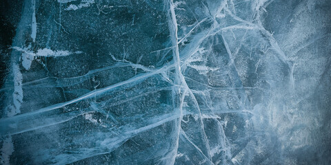 Abstract natural ice texture. Freezy ice surface. Blue backdrop with cracks and scratches on frozen...