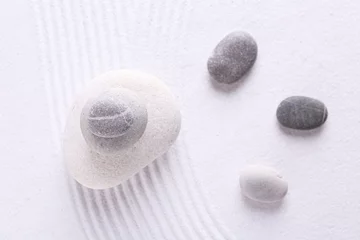 Foto auf Glas Zen garden stones on white sand with pattern, flat lay © New Africa