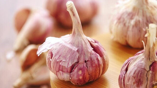 Gyration old garlic on a wooden table background.