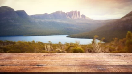Photo sur Plexiglas Mont Cradle The empty wooden brown table top with blur background of Cradle mountain in Tasmania. Exuberant image. generative AI
