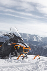 snowmobile in the winter mountains
