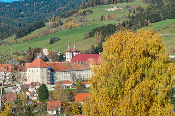Benedictine monastery Saint Lambrecht Abbey surrounded by lush green alpine landscape in mountain...