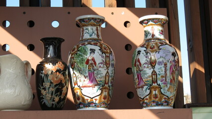 Chinese style porcelain jugs at a flea market