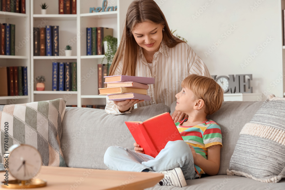 Canvas Prints Little boy and his mother with books at home