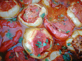 Stuffed peppers close-up background. Ardei umpluti, romanian summer dish with red and yellow bell peppers stuffed with meat