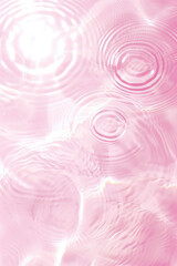 Fototapeta na wymiar Flat lay water texture ripple pastel pink background. Spa, cosmetics or summer concept