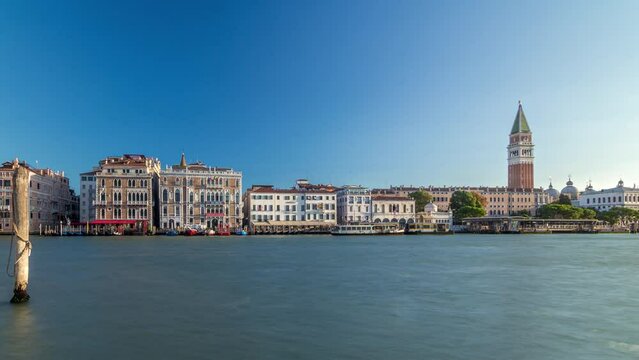 Campanile di San Marco (St Mark's belfry) and Palazzo Giustinian, from San Giorgio Maggiore panoramic timelapse, Venice, Italy. Early morning after sunrise.