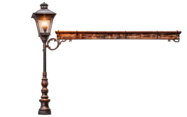 A lamp post stands tall with a glowing light at its peak, casting a warm glow in the darkness