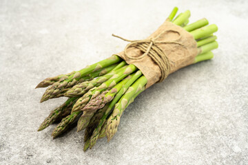 Fresh green asparagus on the vintage white background