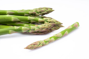 Fresh green asparagus on the white background