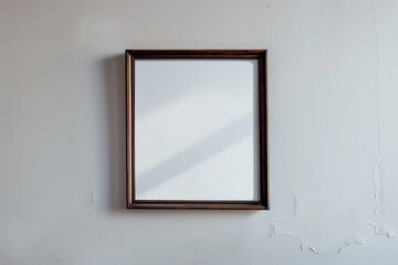 Blank frame on a white wall background