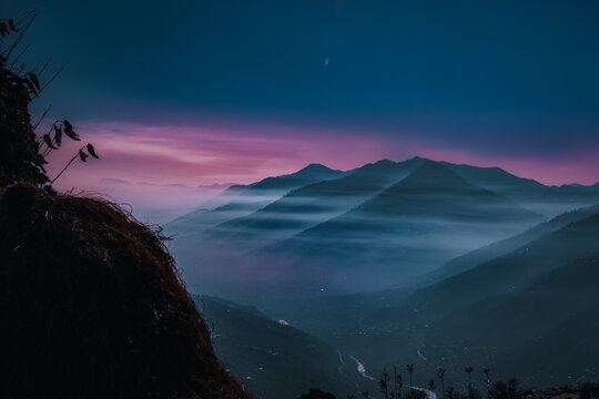 Mountains Landscape Purple Scenery Nature Hiking Outdoors Adventure Rocks Peaks Summit Beauty Wilderness Majestic Serenity Tranquility Exploration Sunset Alpine Elevation Panorama