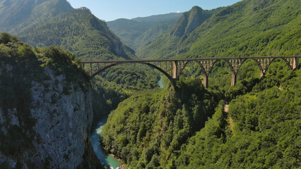 Aerial view on Djurdjevica arch bridge over Tara - obrazy, fototapety, plakaty