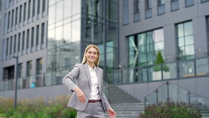 Confident happy businesswoman invites you to join team near entrance to business office building. Female employee, hr entrepreneur, investor calls to invest or hiring people look at camera. Join Us