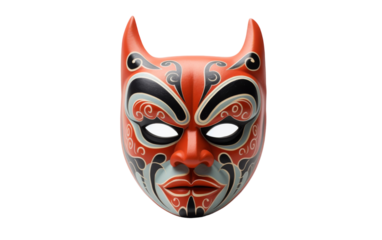 A vibrant red mask adorned with detailed black and white patterns