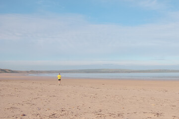 person running on beach