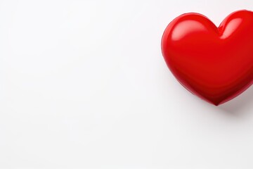 A shiny red heart on a pure white background.