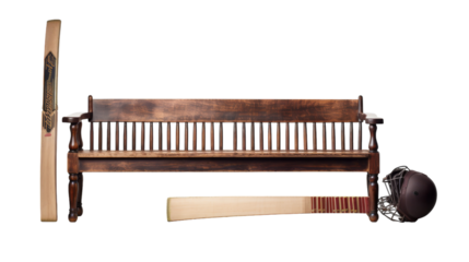 A wooden bench adorned with a cricket bat and ball, basking in the stillness of the moment