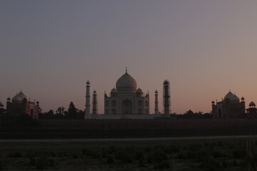 Fototapeta na wymiar Taj Mahal India Monument Architecture Landmark Mughal UNESCO History Mausoleum Symbol Love Emperor Shah Jahan Agra Marble Dome Minarets Reflection River Yamuna Sunrise Magnificent