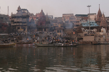 Fototapeta premium Varanasi Ganges Ghats Temples India Sacred Hinduism Pilgrimage Rituals Boat Sunrise Sunset Reflection Spiritual Culture Heritage Tourism Iconic Scenic Views River Asia
