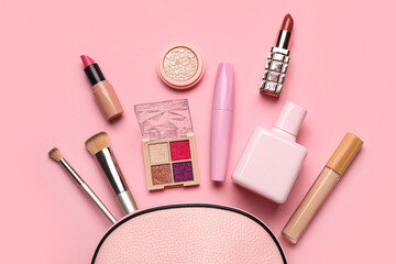 Set of decorative cosmetics with bag on pink background. Top view