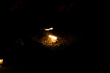 Burning candles on a dark street