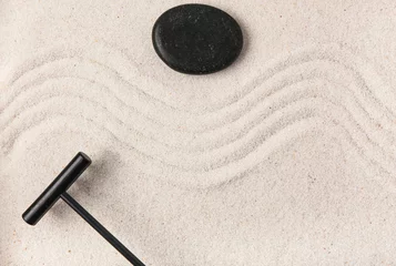 Wandaufkleber Rake and stone on sand with lines in Japanese rock garden. Zen concept © Pixel-Shot