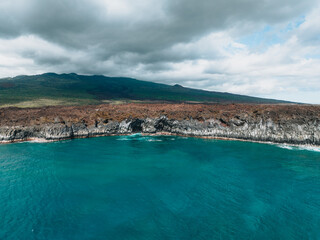 Lava field coastline in Hawaii with turquoise water