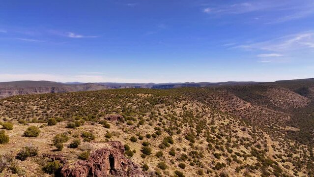 Desert landscape in Arizona state. Drone view landscape of the desert. Old dirt road in the middle of the dry desert. Road in the Canyon with erosion mountains. 