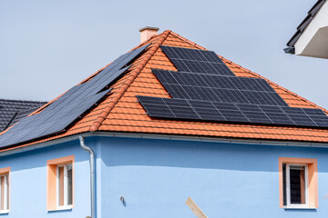 Solar panels producing clean energy on a roof of an old residential house, SHOTLISTeco
