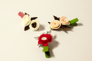 A  handmade hair clip decorated with artificial flowers