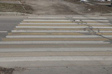 Zebra crossing on the street in the city. Close up
