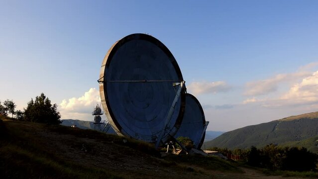 Aerial view of the big parabolic antenna of the NATO radio station abandoned on the top of Monte Giogo, used during cold war. Comano, Massa and Carrara province, Lagastrello lake, Tuscany, Italy. 