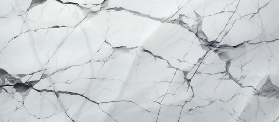 Fototapeta premium Detailed view of a white marble slab showing various intricate cracks and fractures on the surface