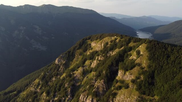 Aerial view of the big parabolic antenna of the NATO radio station abandoned on the top of Monte Giogo, used during cold war. Comano, Massa and Carrara province, Lagastrello lake, Tuscany, Italy. 
