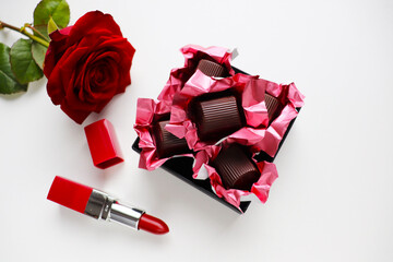 set of chocolates iand red rose. gift concept for woman	
