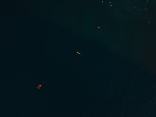 Aerial view of surfers waiting for a wave in hawaii
