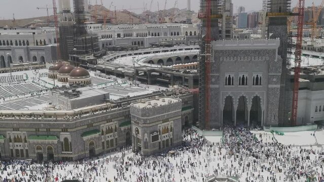 Bird's eye view of Muslim pilgrims exit Masjid Al Haram Mosque via King Abdul Aziz gate in Makkah, Saudi Arabia. Haram Mosque is the holiest mosque in Islam