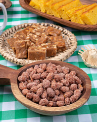 Typical brazilian june festival food over plaid fabric. Festa junina