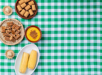 Typical brazilian june festival food over plaid fabric. Festa junina