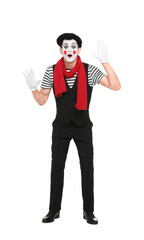 Mime artist making shocked face on white background