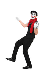 Funny mime artist making shocked face on white background