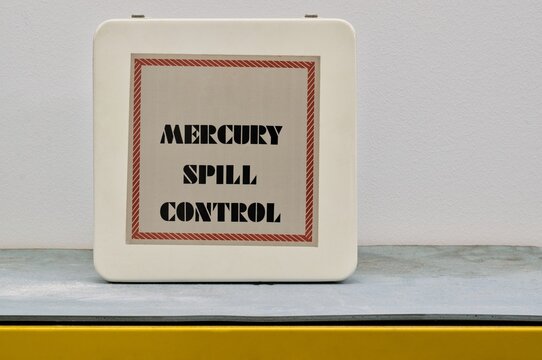 Closed Mercury spill control kit box on shelf with copy space, hazardous danger science laboratory safety equipment concept.	