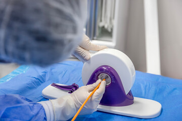Disposable heart valve crimping tool. In the operating room, the doctor prepares the heart valve...