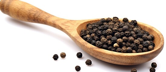 Close up black pepper seeds or peppercorns ( dried seeds of piper nigrum) in wooden bowl and spoon isolated on white background - obrazy, fototapety, plakaty