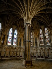Fototapeta premium Lincoln Cathedral, Roman Catholic Gothic church and cathedral with stain glass window corridor and hall, with arches, columns, pews, vault, aisles, gallery, arcades and clerestory.