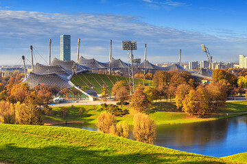 Autumn cityscape - view of the Olympiapark or Olympic Park and Olympic Lake in Munich, Bavaria, Germany