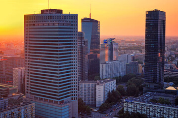 Cityscape at sunset - top view of the Downtown district of Warsaw with high-rise buildings, located within the Wola district in western Warsaw, Poland
