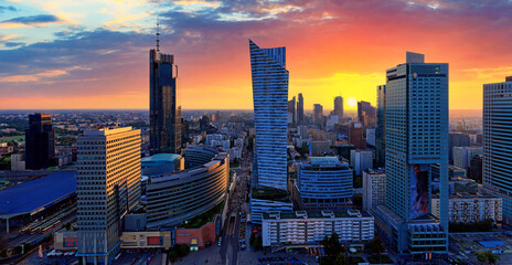 Cityscape at sunset, panorama, banner - top view of the Downtown district of Warsaw with high-rise buildings, located within the Wola district in western Warsaw, Poland